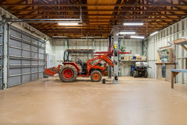 a view of a road with large trees