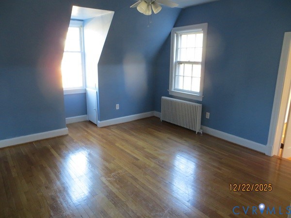 1124 Woodland Road Petersburg, VA 23805 - Photo 3 of 11 an empty room with wooden floor and windows