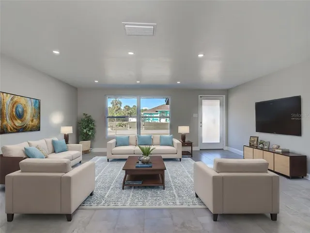 a view of an empty room with a window