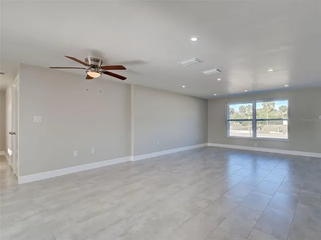 a view of an empty room and window