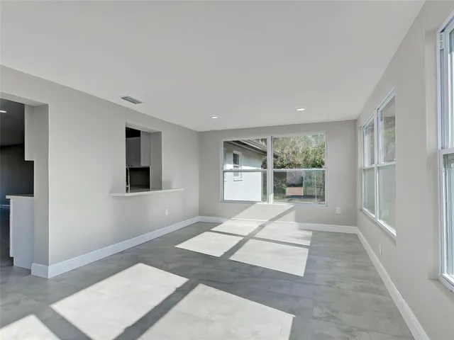 a bedroom with a bed and a desk