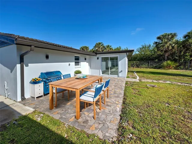 an aerial view of a residential houses with outdoor space