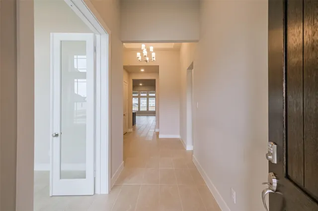 a view of a hallway with wooden shelves