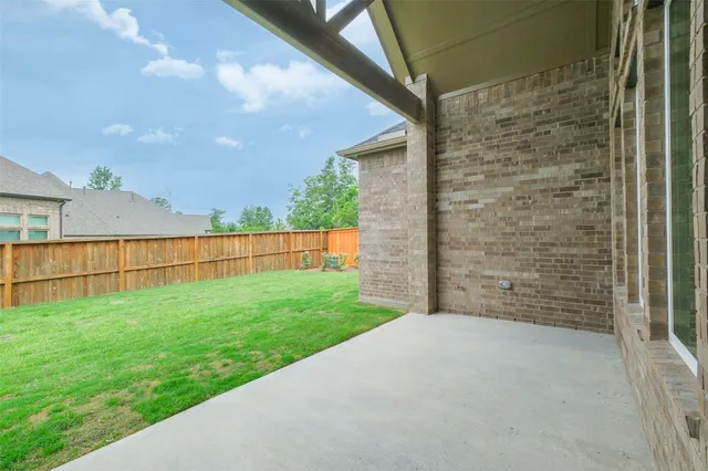 a view of a brick house with a large window