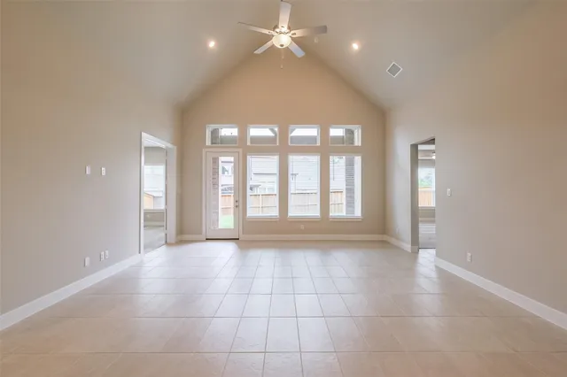 a view of an empty room with glass door