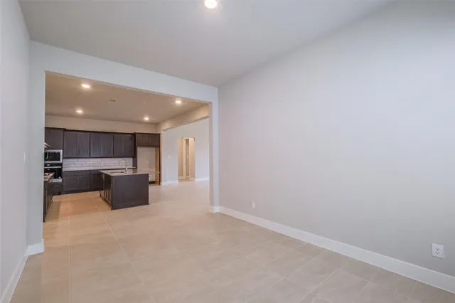 a view of a kitchen with a sink and cabinets