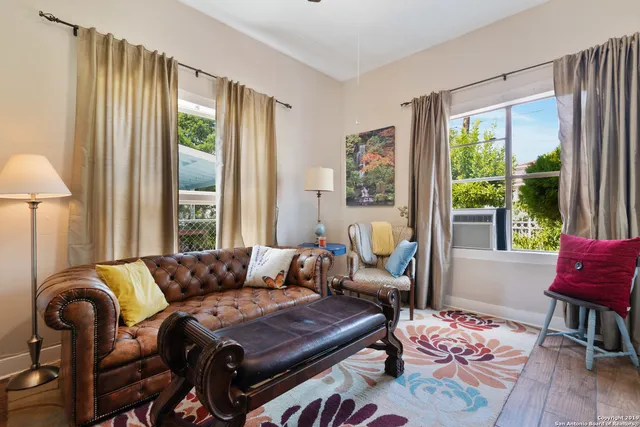 a living room with furniture and a window