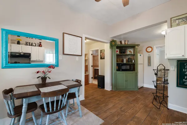 a dining room with furniture and window