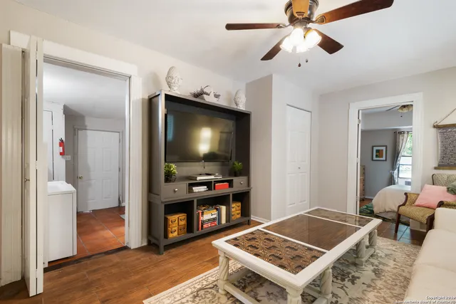 a living room with furniture and a flat screen tv