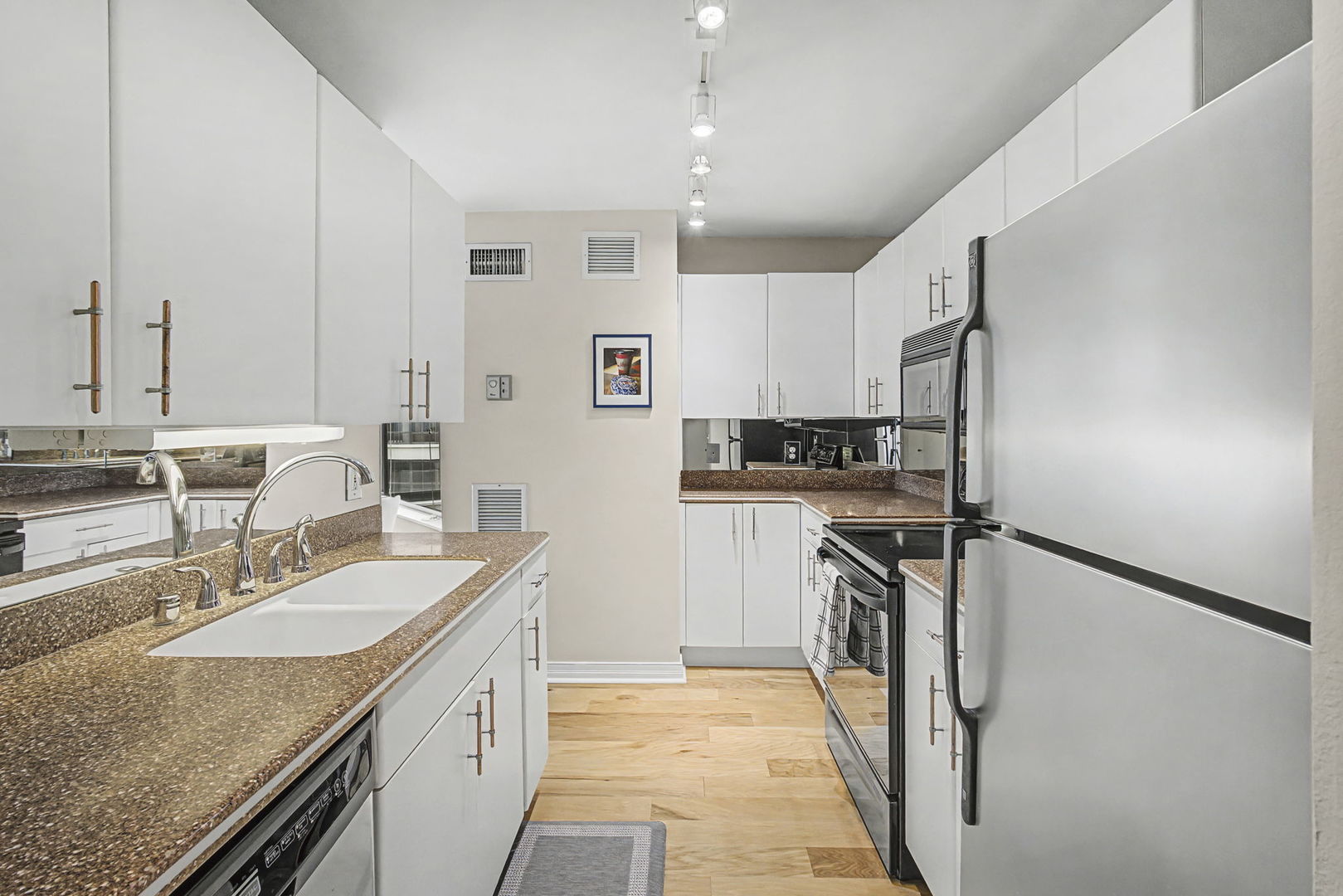 401 East Ontario Street, Unit 3102 Chicago, IL 60611 - Photo 13 of 29 a kitchen with a sink stove and refrigerator