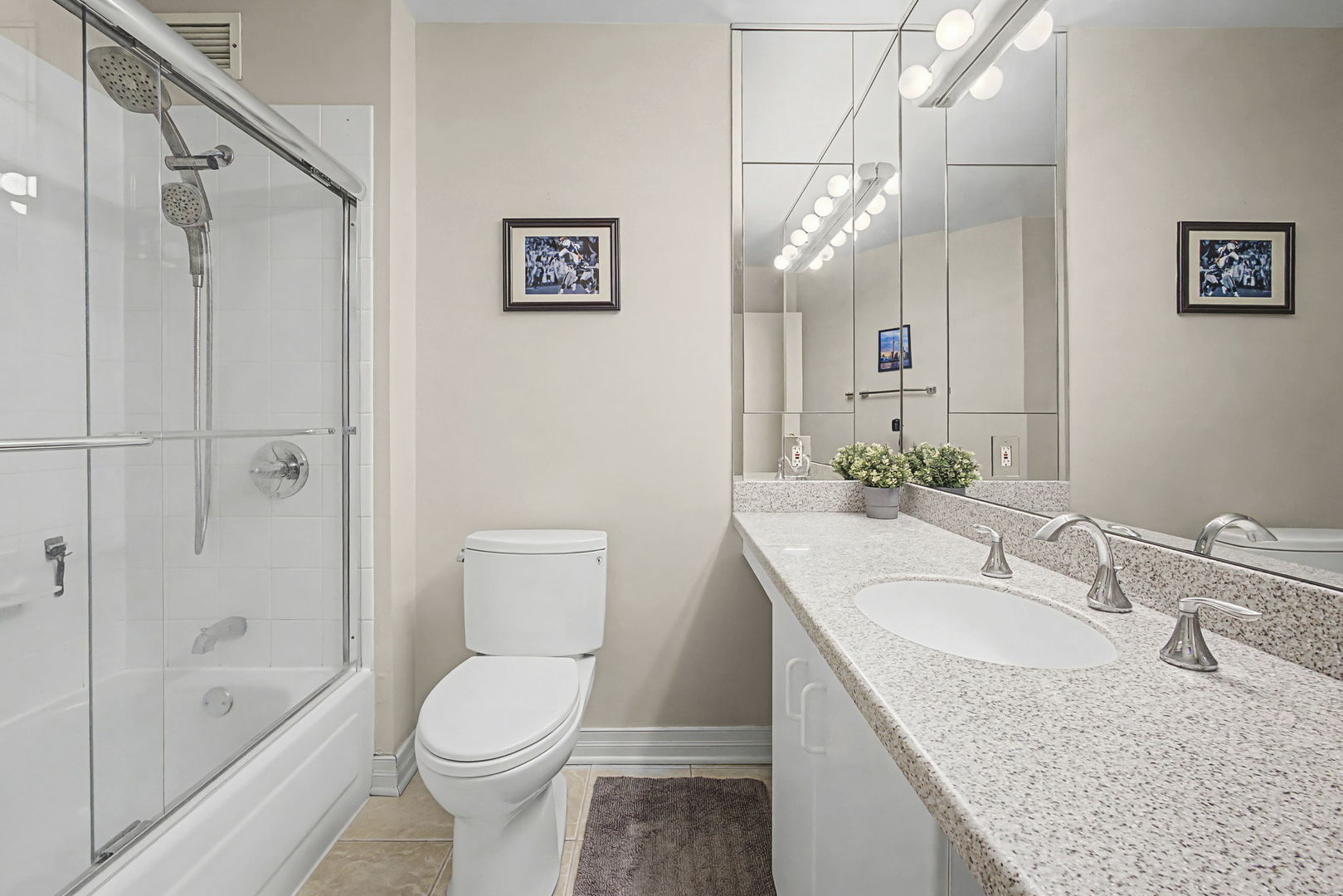 401 East Ontario Street, Unit 3102 Chicago, IL 60611 - Photo 19 of 29 a bathroom with a granite countertop sink a toilet and shower