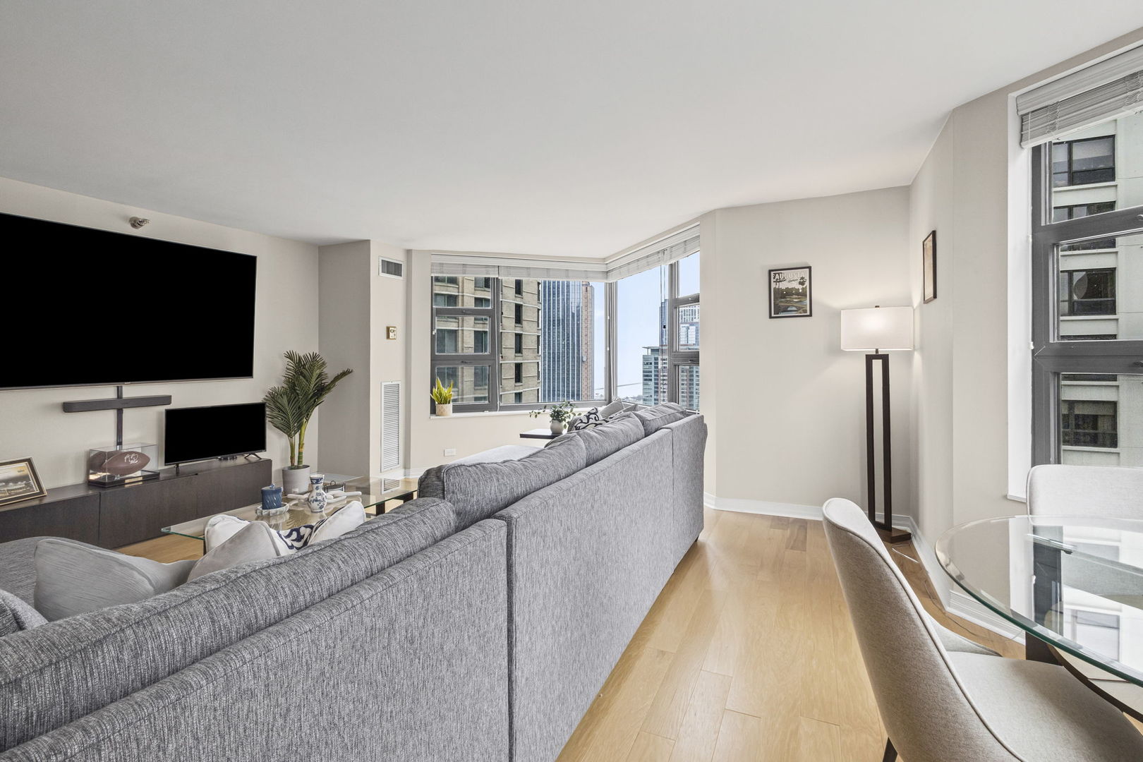 401 East Ontario Street, Unit 3102 Chicago, IL 60611 - Photo 8 of 29 a living room with furniture and a flat screen tv