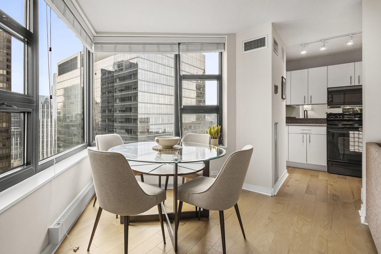 401 East Ontario Street, Unit 3102 Chicago, IL 60611 - Photo 10 of 29 a view of a dining room with furniture and a window
