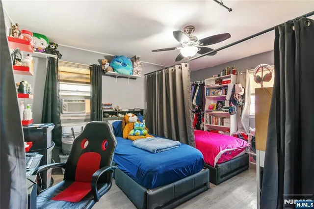 a white toilet sitting next to a bathroom next to a window