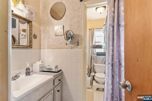 a garden view with a seating space and swimming pool