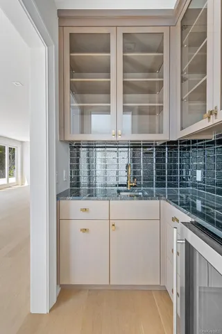 a view of entryway with wooden floor and stairs
