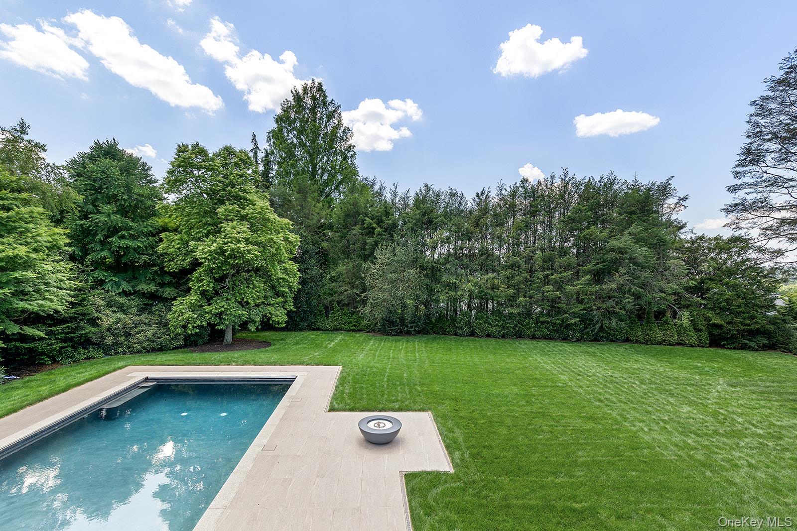 42 Mamaroneck Road Scarsdale, NY 10583 - Photo 31 of 49 View of the resort-style property. sparkling 20x40 gunite pool with integrated spa, patio, and fire pit.
