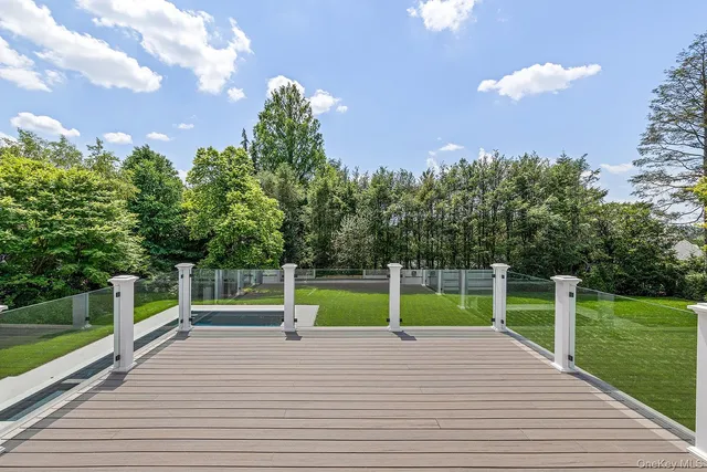 a bathroom with a bathtub sink and mirror