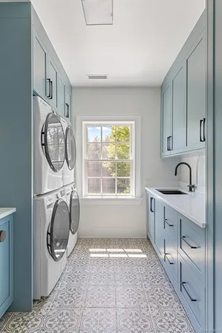 a bathroom with a double vanity sink and mirror