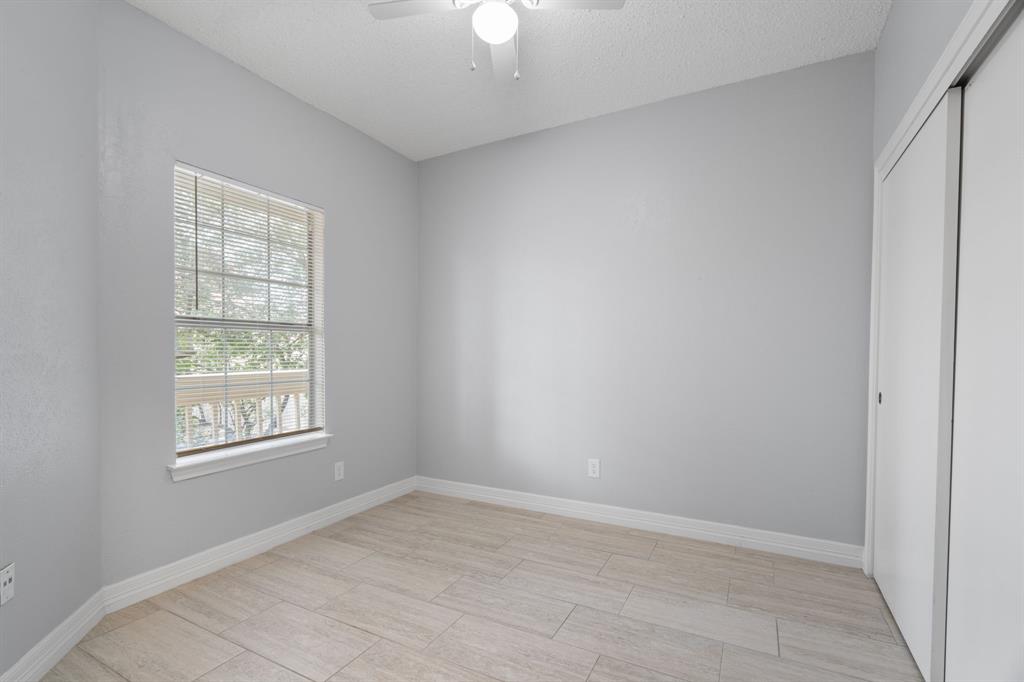5310 Keller Springs Road, Unit 626 Dallas, TX 75248 - Photo 11 of 13 an empty room with windows and closet