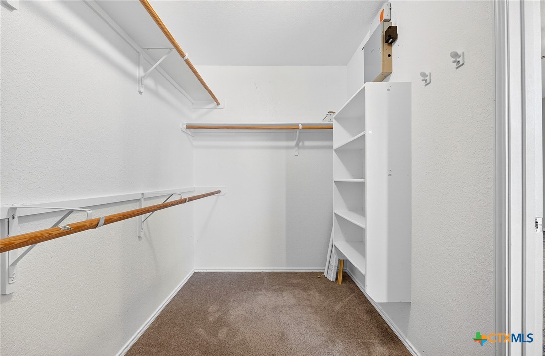 6204 Taree Loop Killeen, TX 76549 - Photo 17 of 24 a view of walk in closet with empty racks