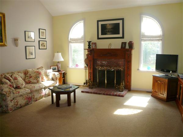 223 Green Road Bolton, MA 01740 - Photo 2 of 21 a living room with furniture and a fireplace