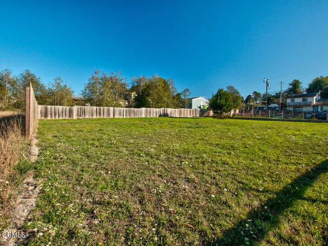 a view of a large body of water with a building in the background