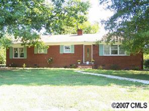 2318 Goldmine Road Monroe, NC 28110 - Photo 1 of 8 a front view of a house with a yard