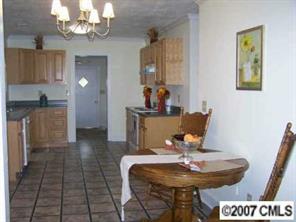 2318 Goldmine Road Monroe, NC 28110 - Photo 3 of 8 a view of a dining room with furniture