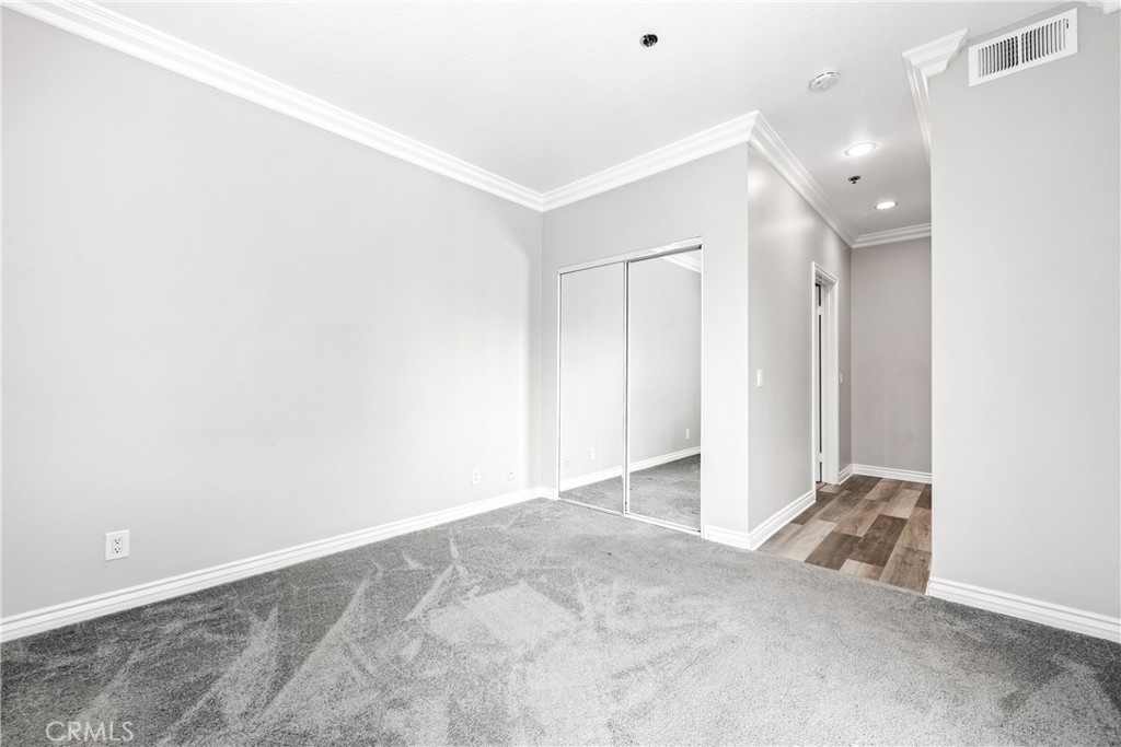 20301 Bluffside Circle, Unit 304 Huntington Beach, CA 92646 - Photo 30 of 36 an empty room with closet