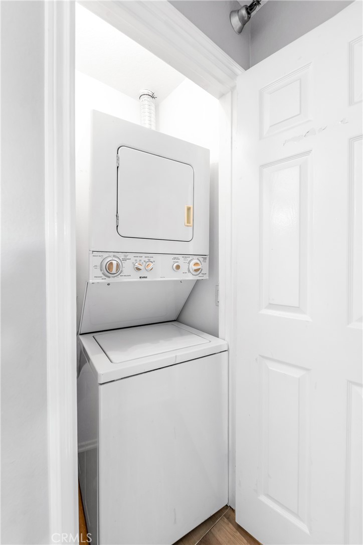 20301 Bluffside Circle, Unit 304 Huntington Beach, CA 92646 - Photo 32 of 36 a utility room with dryer and washer