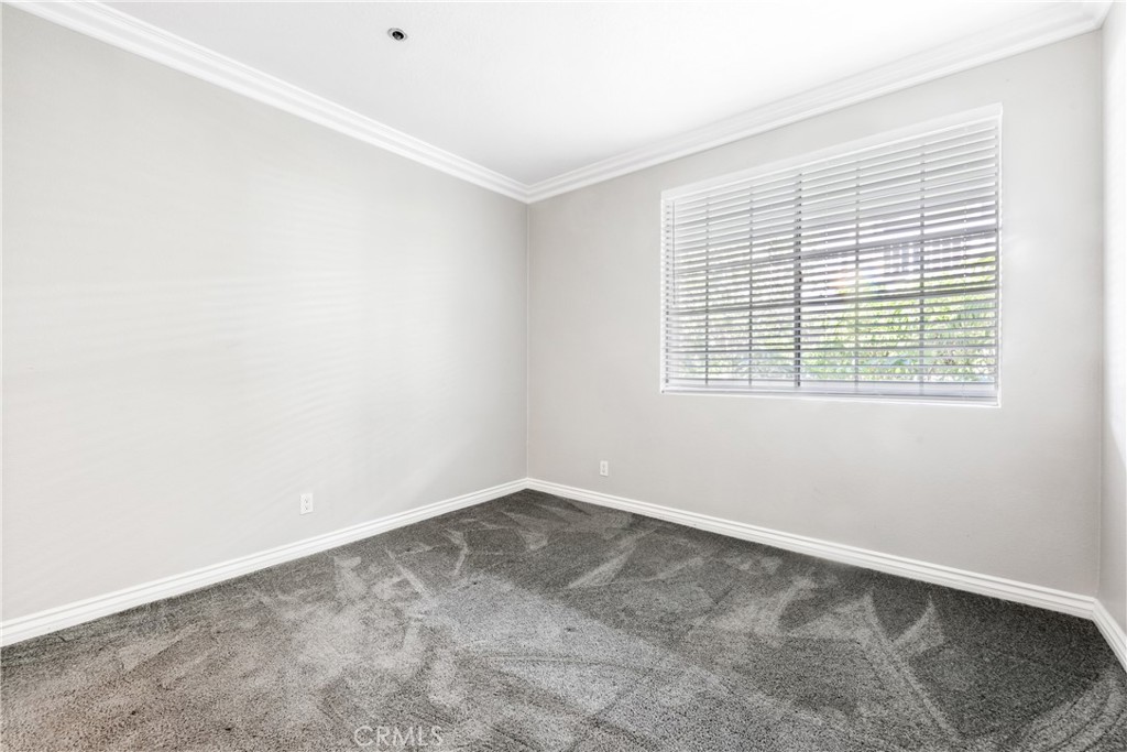 20301 Bluffside Circle, Unit 304 Huntington Beach, CA 92646 - Photo 33 of 36 an empty room with a window