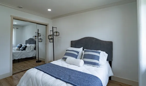 a bedroom with a bed and a view of bedroom