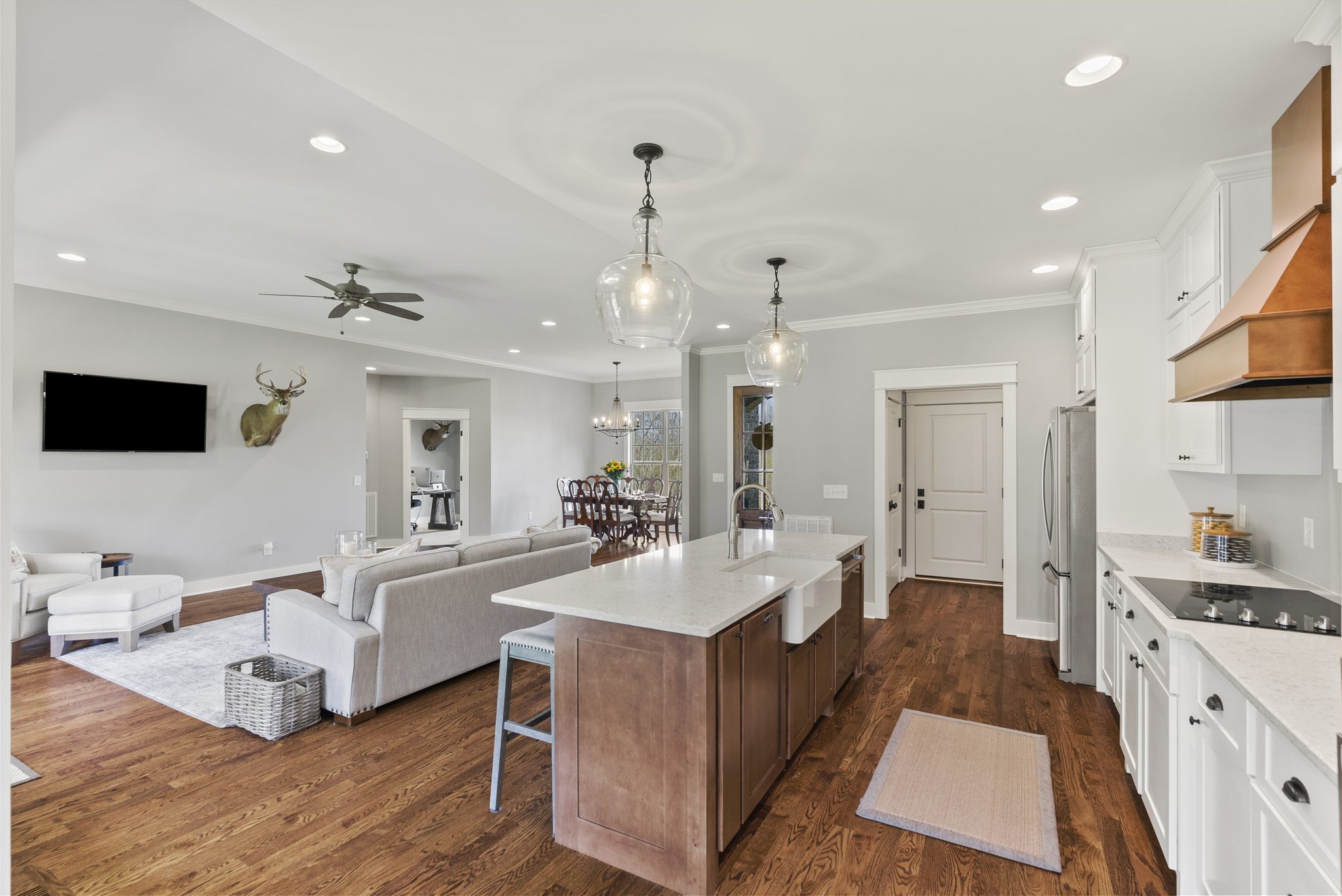 3459 Thompson Road Springfield, TN 37172 - Photo 16 of 39 a large room with kitchen island a flat screen tv and a view of living room