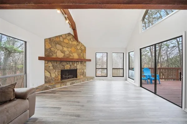 a large kitchen with stainless steel appliances granite countertop a stove and cabinets