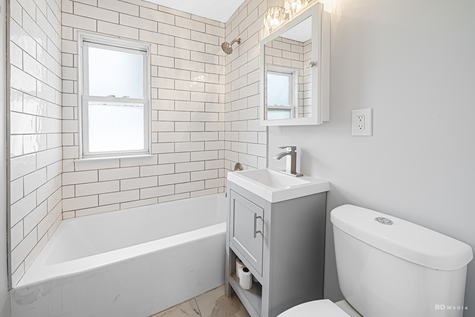 446 Warren Street Calumet City, IL 60409 - Photo 12 of 20 a bathroom with a toilet sink and mirror
