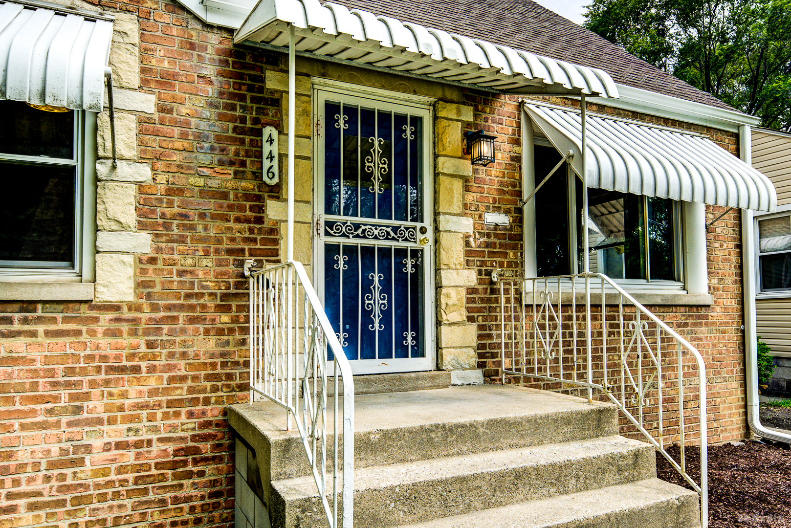 446 Warren Street Calumet City, IL 60409 - Photo 20 of 20 a front view of a house with a iron fence