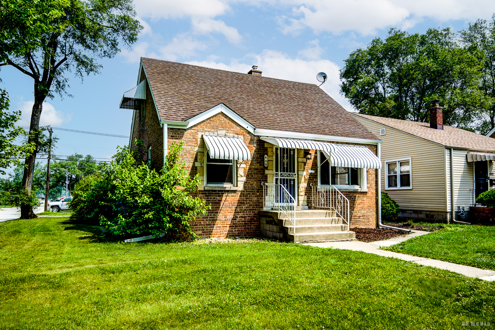 446 Warren Street Calumet City, IL 60409 - Photo 2 of 20 a front view of a house with a garden