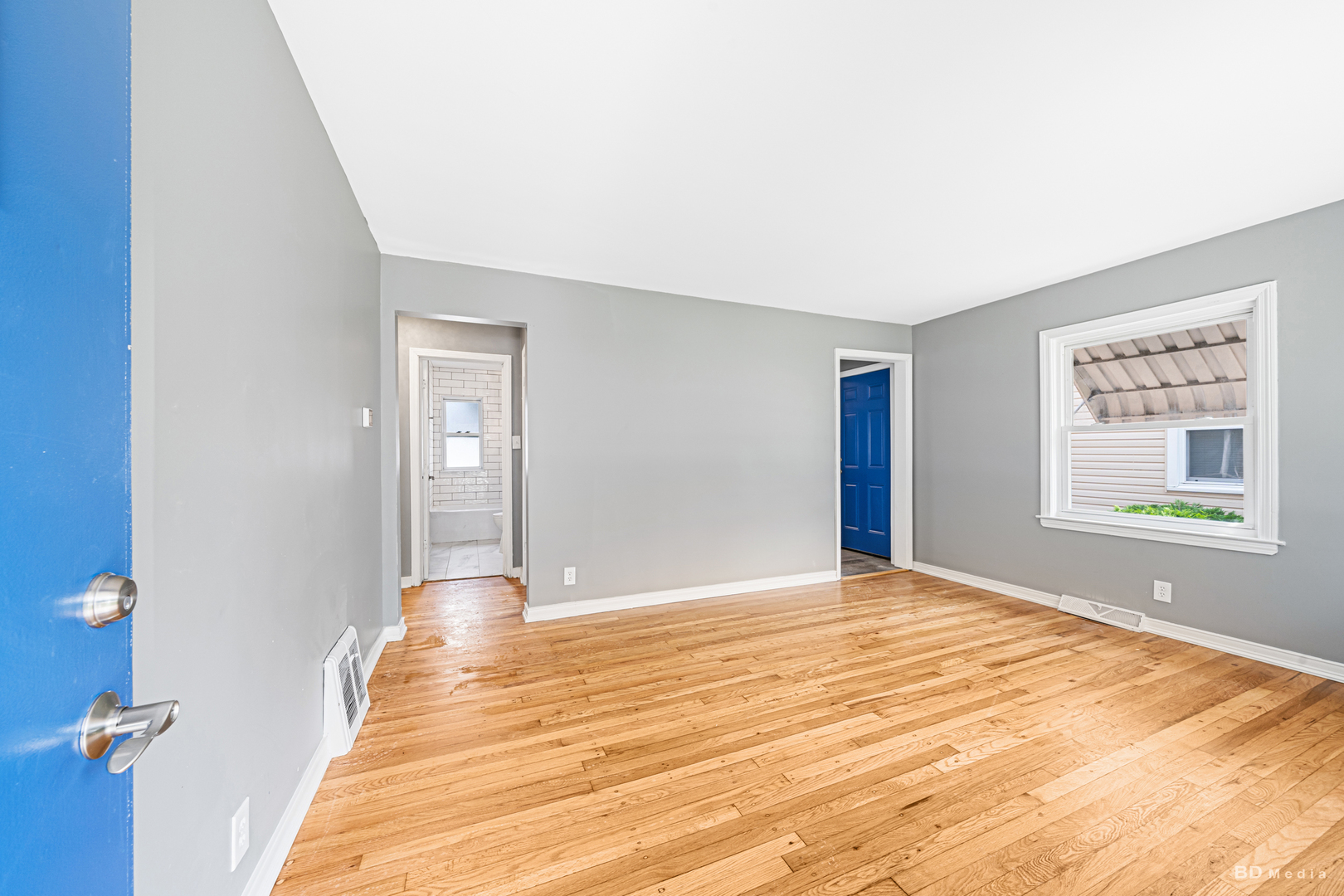 446 Warren Street Calumet City, IL 60409 - Photo 6 of 20 a view of empty room with window and wooden floor