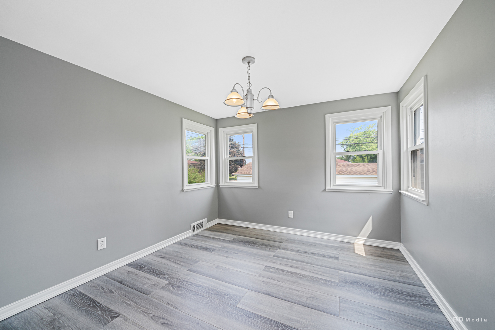 446 Warren Street Calumet City, IL 60409 - Photo 10 of 20 a view of wooden floor and windows in a room