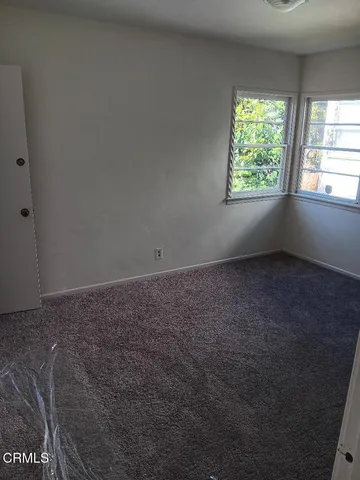 a bathroom with a shower a toilet and a sink