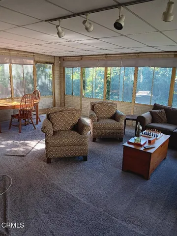 a backyard of a house with a garden and plants