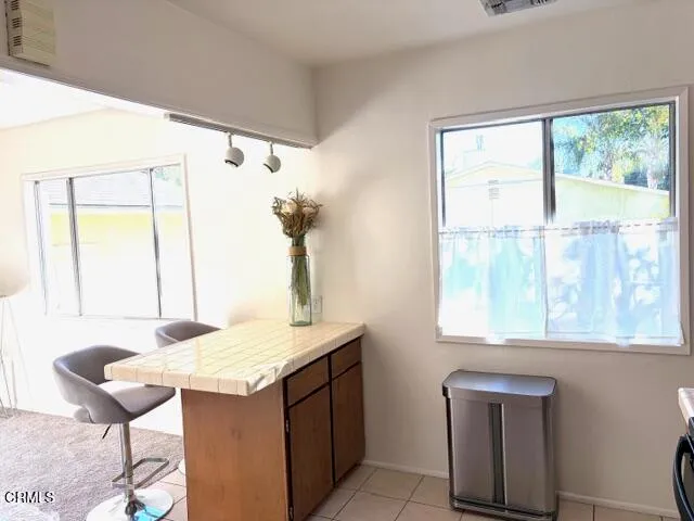 a view of kitchen with furniture and window