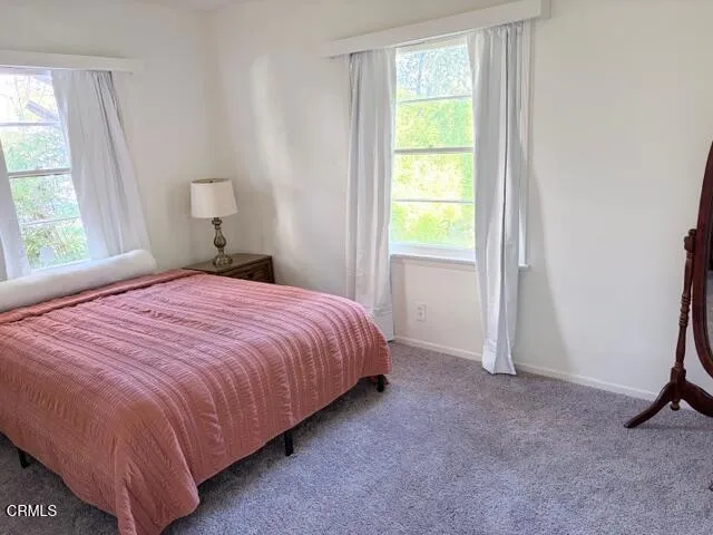 a view of living room with furniture and floor to ceiling window
