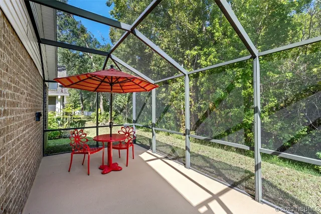 a view of a small house with a patio