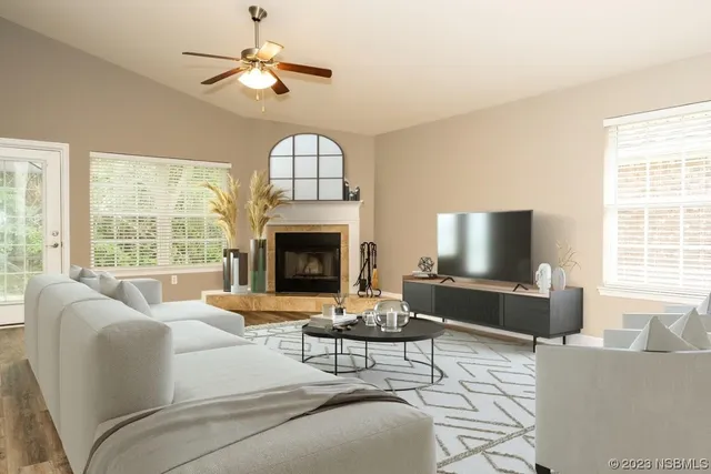 a living room with a fireplace and a window