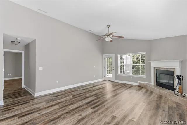 a spacious bedroom with a bed and window