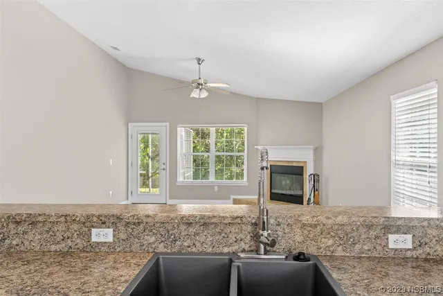 a bedroom with a bed and a large mirror with a flat tv screen