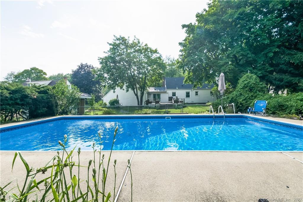 16 Roberts Road Enfield, CT 06082 - Photo 1 of 1 a view of a swimming pool with a yard