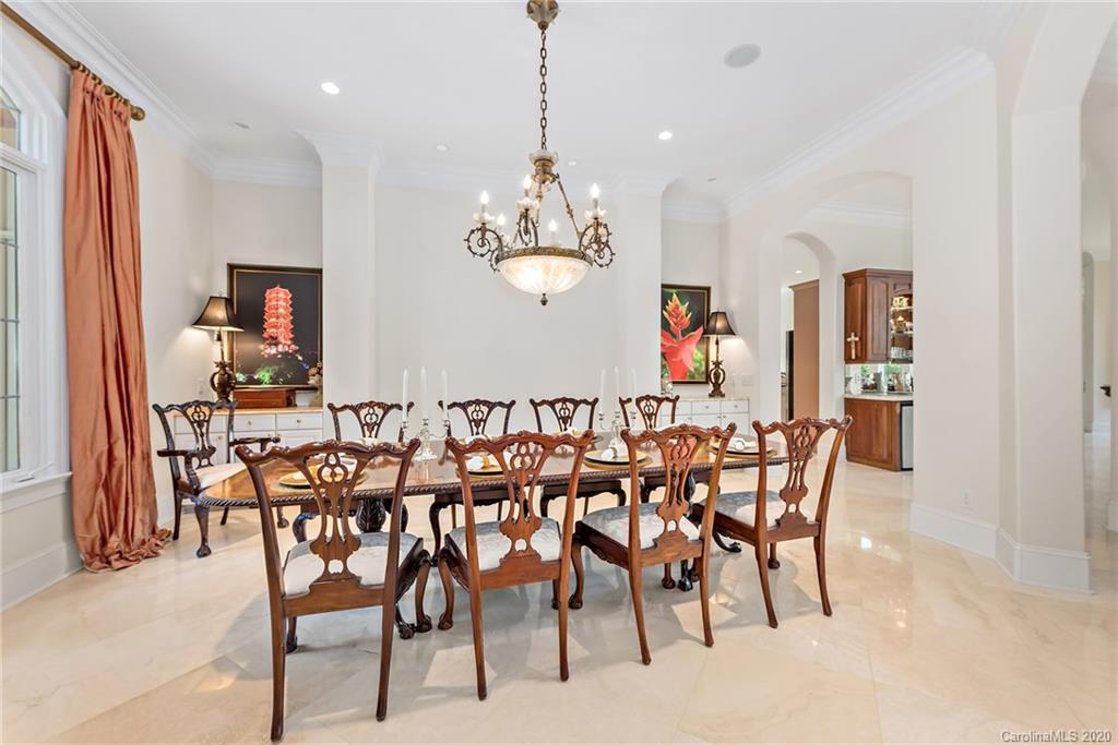20124 Bascom Ridge Drive Cornelius, NC 28031 - Photo 23 of 40 a view of a dining room with furniture